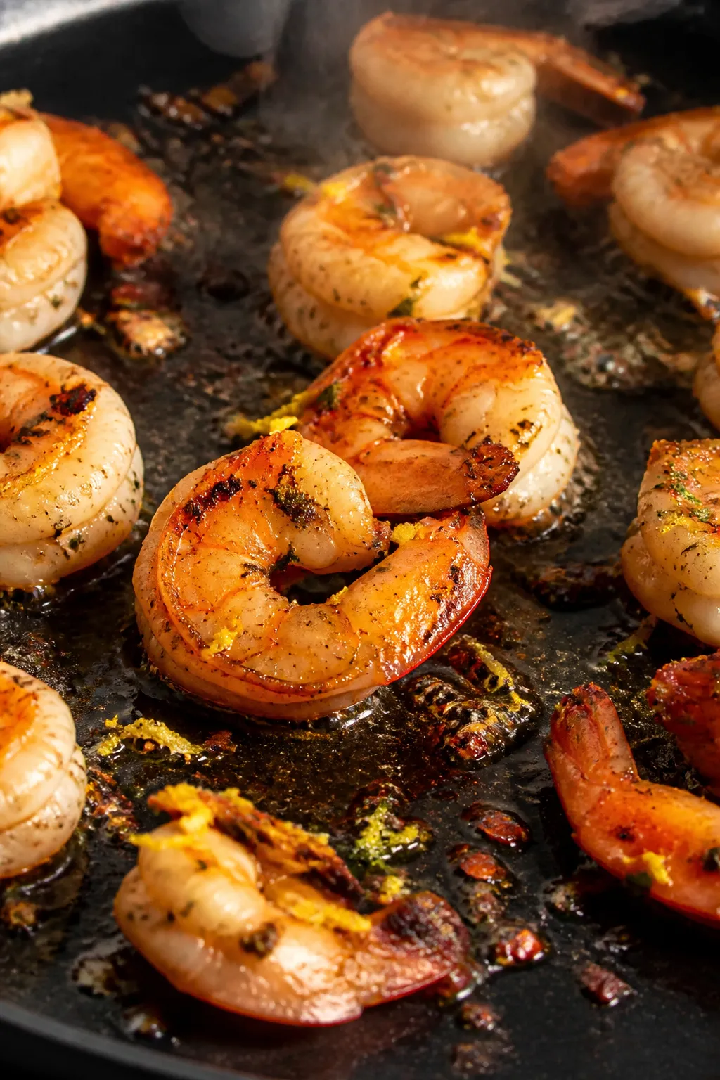 Cooking process — Shrimp sear in action: Medium-high heat skillet scene with seasoned shrimp (papr