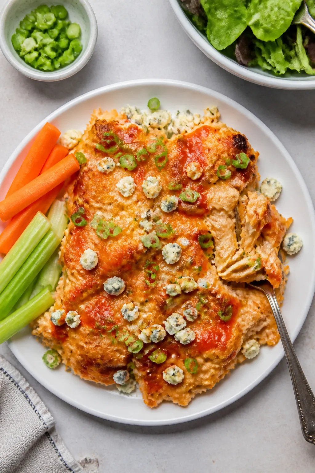 Tasty top view (final presentation): Overhead shot of a generous plated serving of the casserole on
