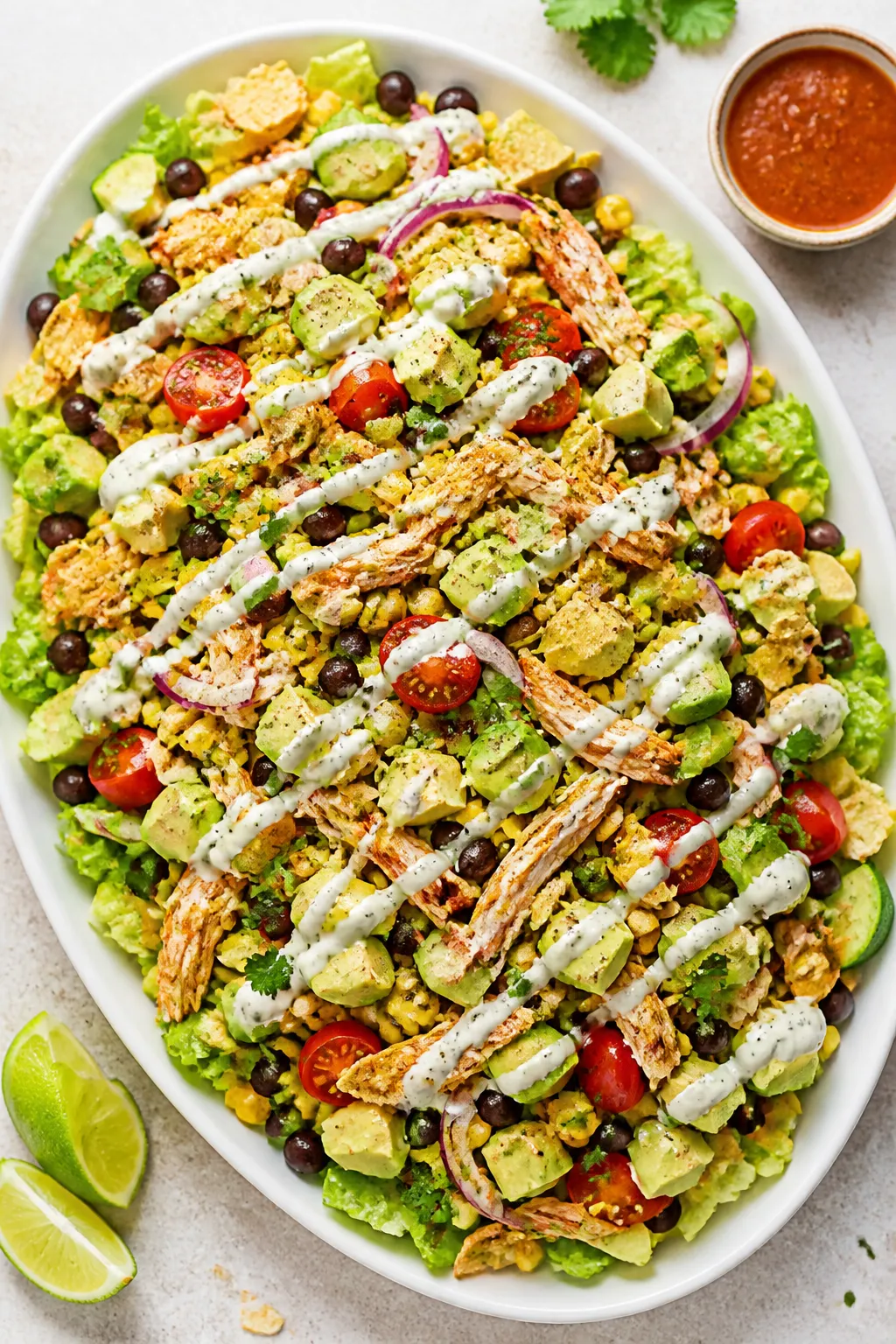 Tasty top view: Overhead shot of the assembled High Protein Rotisserie Chicken Taco Salad on a wide,