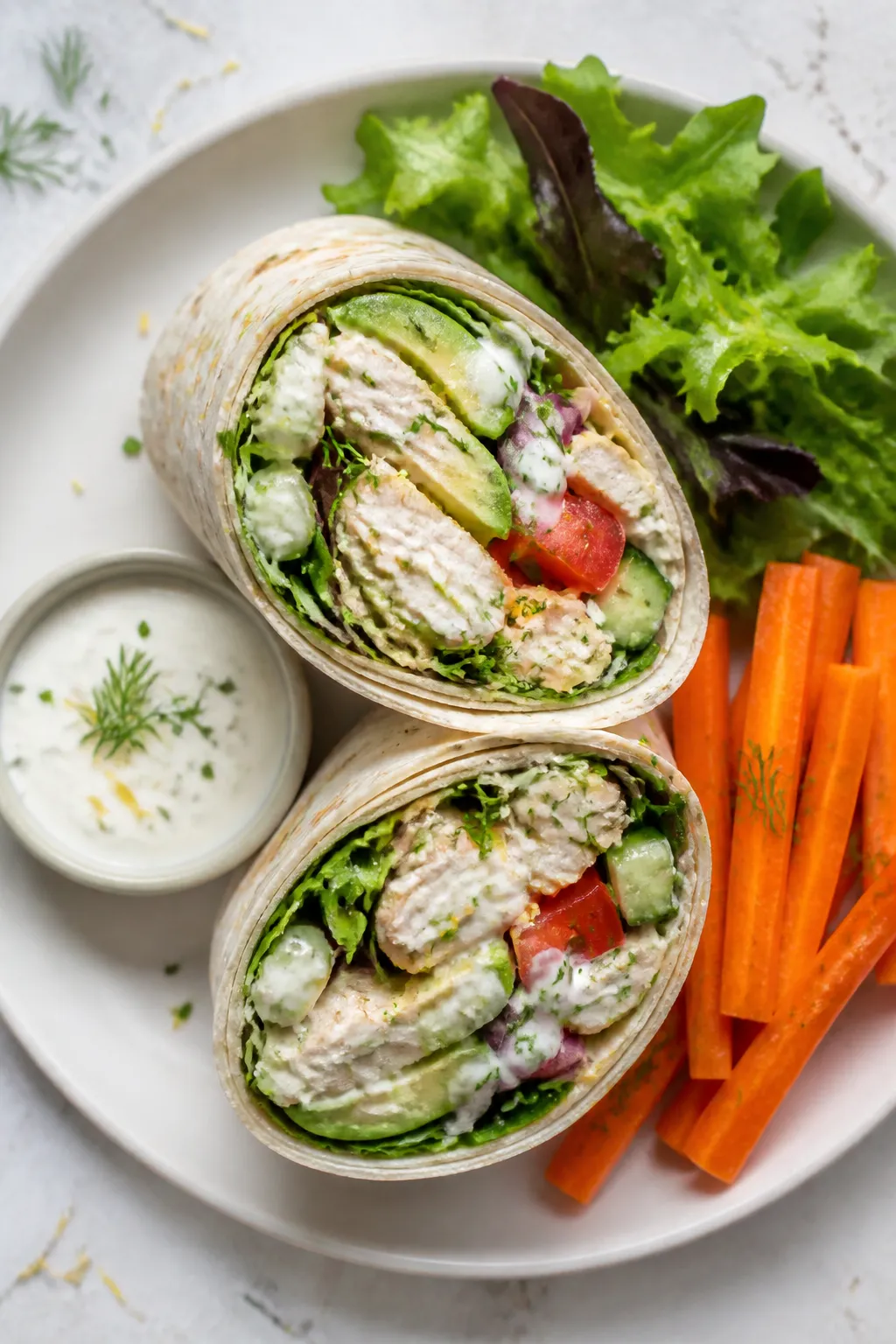 Tasty top view: Overhead shot of two diagonally sliced High Protein Rotisserie Chicken Ranch Wrap ha